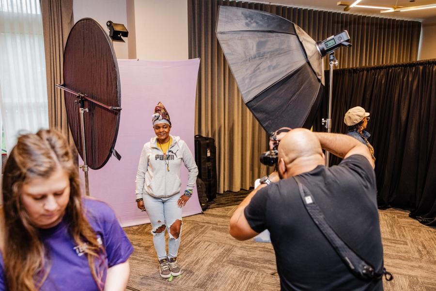 A photographer taking a picture of a woman.