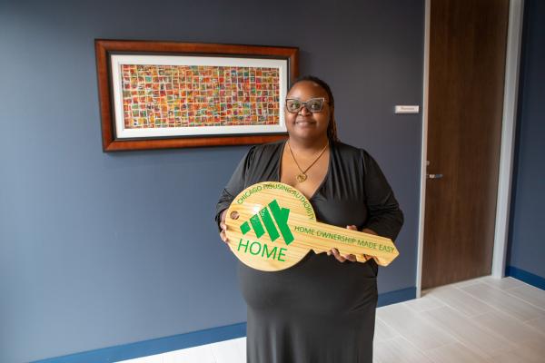 Samantha Stokes poses with a CHA HOME key 